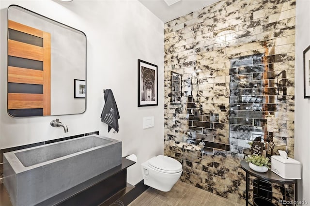 bathroom featuring vanity, toilet, and wood finished floors