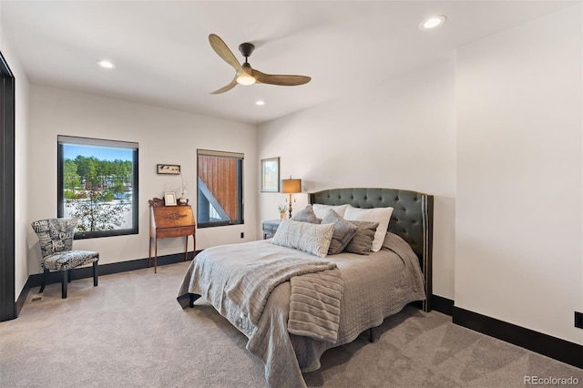 bedroom featuring light carpet, ceiling fan, baseboards, and recessed lighting