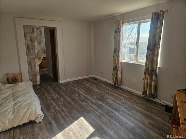 bedroom featuring dark hardwood / wood-style flooring