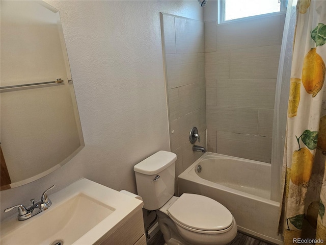 full bathroom featuring sink, shower / tub combo, and toilet