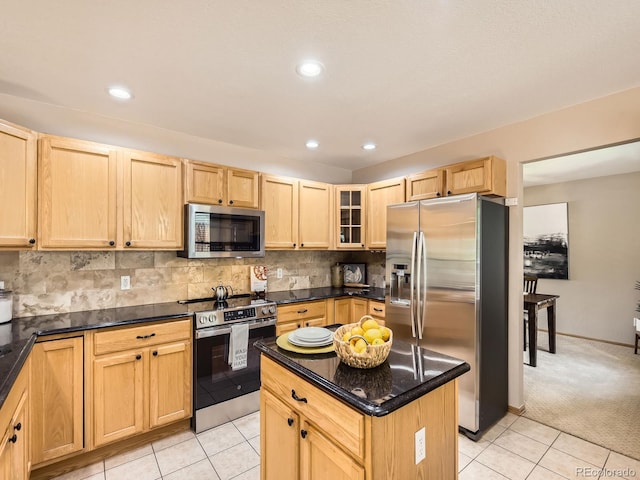 kitchen featuring stainless steel appliances, light brown cabinets, light tile patterned floors, glass insert cabinets, and recessed lighting