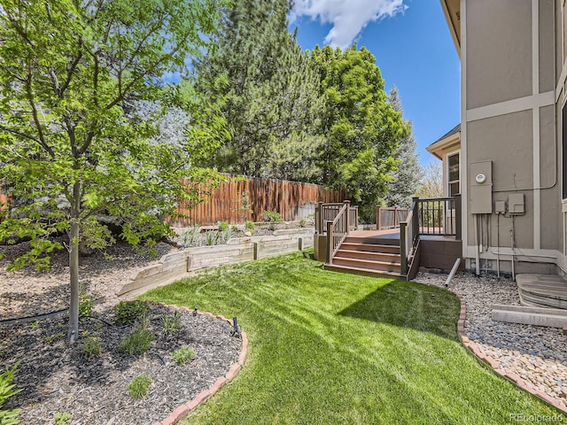 view of yard featuring a wooden deck