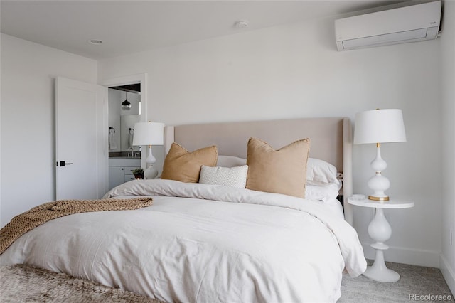 1322 Raleigh St, Denver, CO 80204 - carpeted bedroom featuring ensuite bath, an AC wall unit, and baseboards