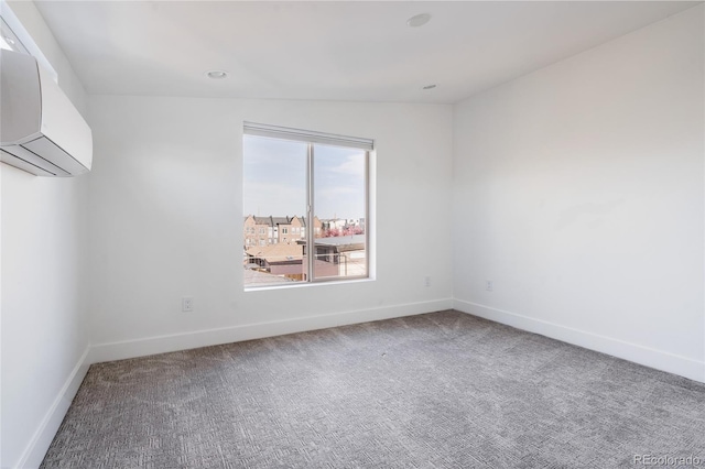 1322 Raleigh St, Denver, CO 80204 - carpeted empty room featuring a wall mounted air conditioner and baseboards