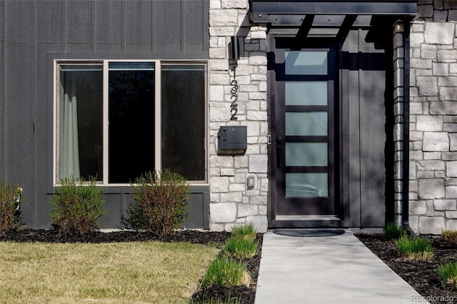 1322 Raleigh St, Denver, CO 80204 - doorway to property featuring stone siding and a lawn