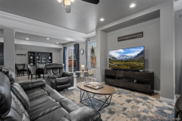 living area with ceiling fan, recessed lighting, baseboards, and wood finished floors