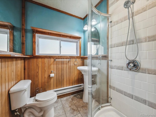 366 Houston St, Bailey, CO 80421 - full bathroom with a baseboard heating unit, a stall shower, toilet, crown molding, and a wainscoted wall