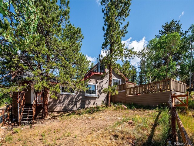 366 Houston St, Bailey, CO 80421 - view of yard featuring a wooden deck and stairway