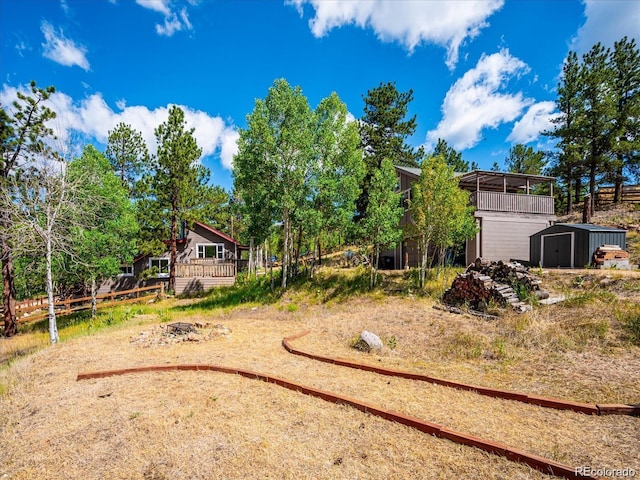 366 Houston St, Bailey, CO 80421 - view of yard with a storage shed, an outbuilding, and a wooden deck