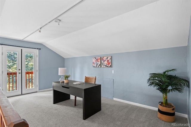 home office with carpet floors, track lighting, and lofted ceiling