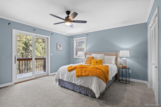 bedroom featuring carpet, access to exterior, ornamental molding, and a closet