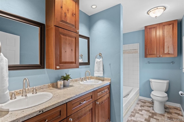 full bathroom featuring tile patterned flooring, vanity, toilet, and tiled shower / bath combo