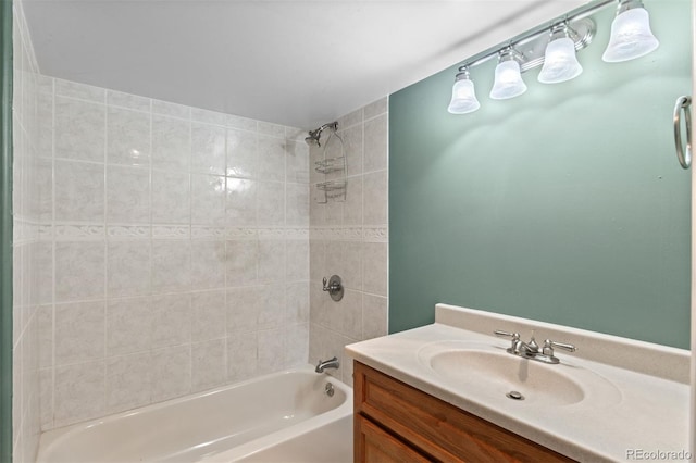 bathroom with vanity and tiled shower / bath combo