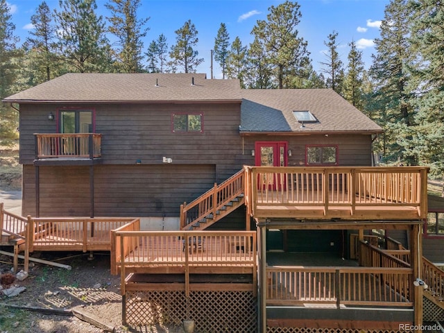 back of house featuring a deck