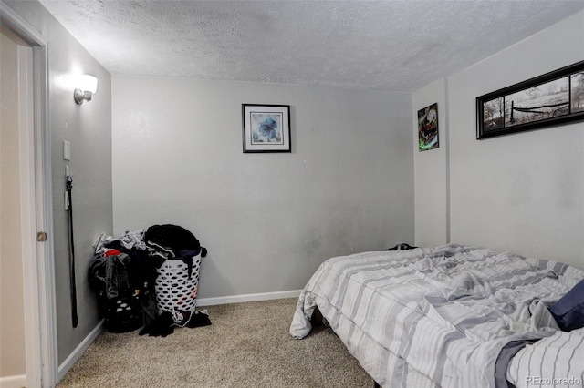 841 Crisman Dr Unit 9, Longmont, CO 80501 - bedroom featuring a textured ceiling and carpet flooring