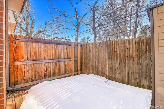 view of yard covered in snow