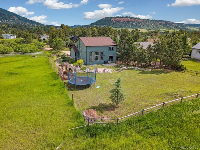 133 Wheat Ridge St, Palmer Lake, CO 80133 - aerial view of property and surrounding area with a mountain backdrop