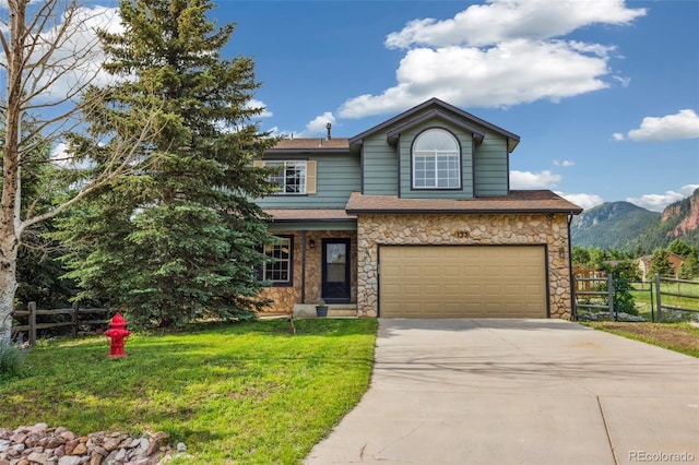 133 Wheat Ridge St, Palmer Lake, CO 80133 - view of front of house with an attached garage, driveway, stone siding, a mountain view, and a shingled roof