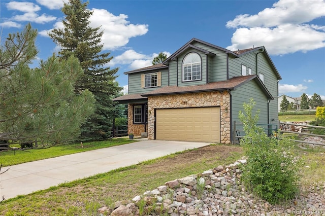 133 Wheat Ridge St, Palmer Lake, CO 80133 - view of front of property with stone siding, driveway, and an attached garage