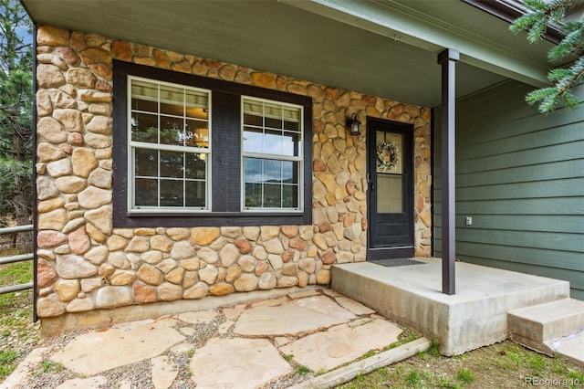 133 Wheat Ridge St, Palmer Lake, CO 80133 - doorway to property featuring stone siding