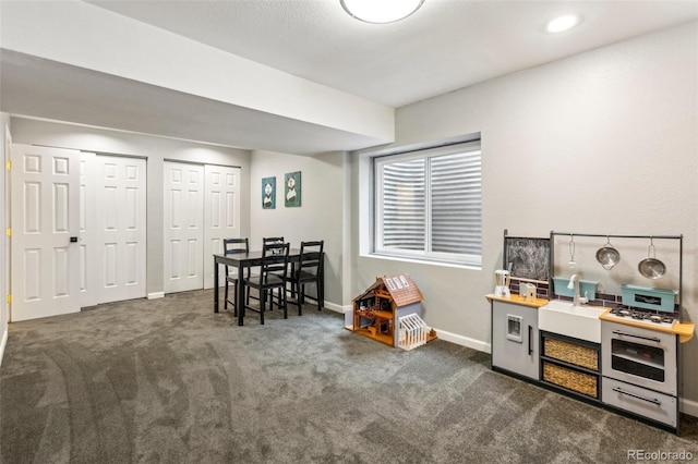 133 Wheat Ridge St, Palmer Lake, CO 80133 - recreation room with carpet and baseboards