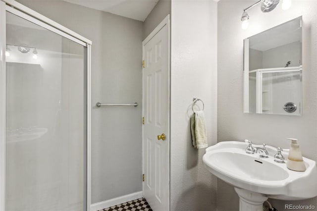 133 Wheat Ridge St, Palmer Lake, CO 80133 - bathroom featuring a shower stall and a sink