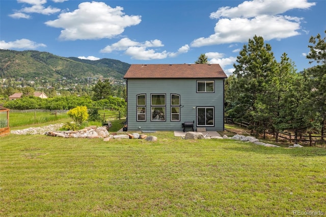 133 Wheat Ridge St, Palmer Lake, CO 80133 - back of house with a mountain view and a patio