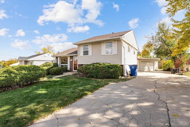 view of front of property with a garage and a front yard