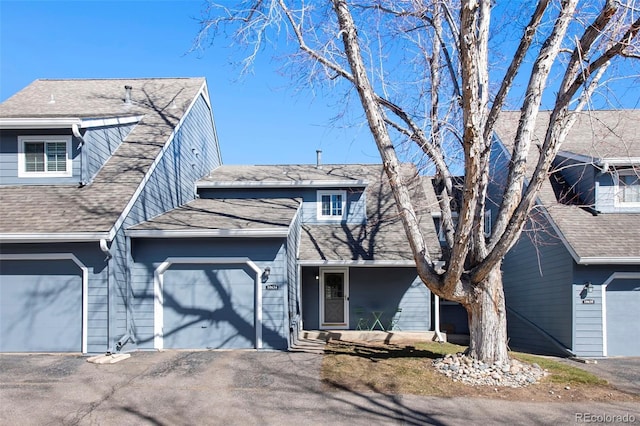 view of front of home with driveway and an attached garage