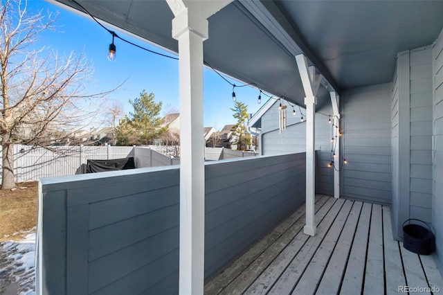 wooden deck featuring fence