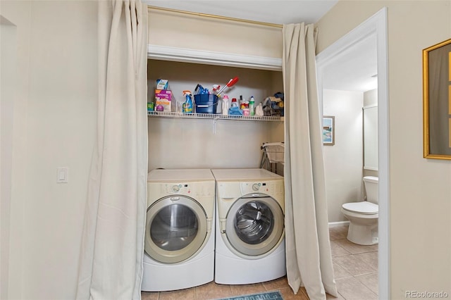 washroom with laundry area, tile patterned flooring, and washer and dryer