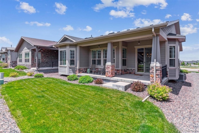 22656 E Glidden Dr, Aurora, CO 80016 - view of front facade featuring a front lawn and stone siding