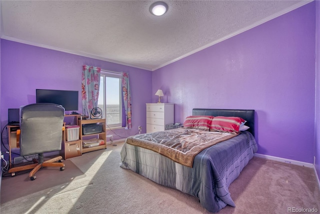 carpeted bedroom featuring crown molding, baseboards, and a textured ceiling