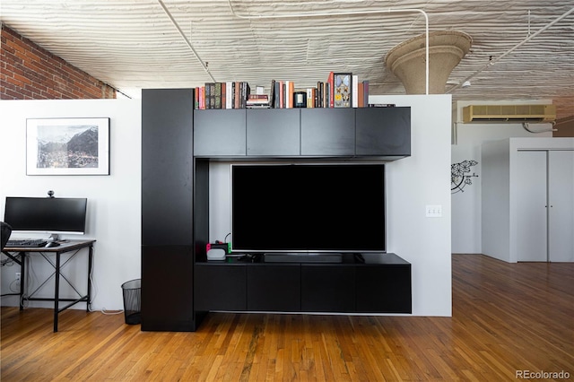 2261 Blake St Unit 5H, Denver, CO 80205 - detailed view of a wall mounted AC and wood finished floors
