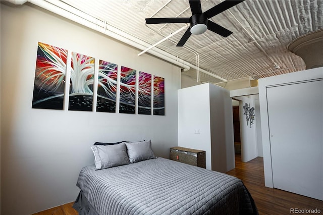2261 Blake St Unit 5H, Denver, CO 80205 - bedroom featuring wood finished floors and ceiling fan