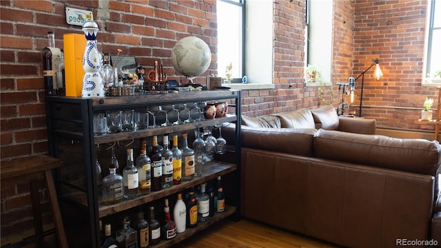 2261 Blake St Unit 5H, Denver, CO 80205 - detailed view of brick wall and wood finished floors
