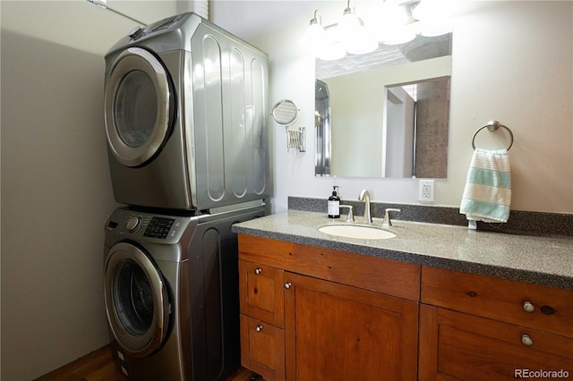 2261 Blake St Unit 5H, Denver, CO 80205 - laundry area with stacked washer / drying machine, cabinet space, and dark wood-style flooring