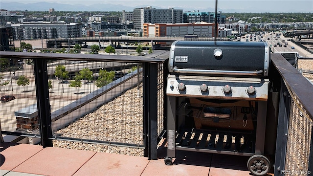 2261 Blake St Unit 5H, Denver, CO 80205 - balcony featuring a grill, a view of city, and a mountain view