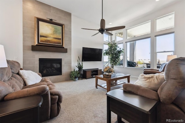 18926 W 94th Ave, Arvada, CO 80007 - living area with carpet, a ceiling fan, a tile fireplace, and recessed lighting