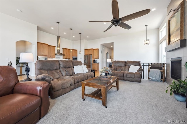 18926 W 94th Ave, Arvada, CO 80007 - living area with ceiling fan, light carpet, recessed lighting, and a tile fireplace