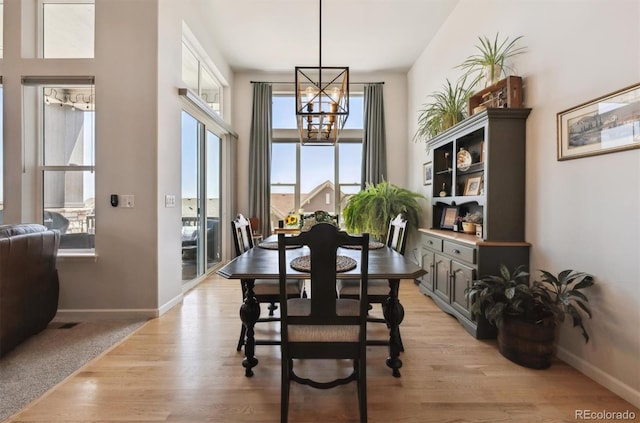 18926 W 94th Ave, Arvada, CO 80007 - dining area featuring a chandelier and light wood finished floors