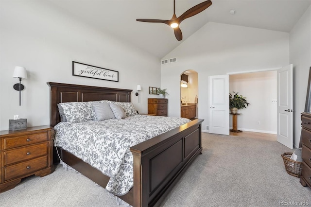18926 W 94th Ave, Arvada, CO 80007 - bedroom with light carpet, arched walkways, high vaulted ceiling, a ceiling fan, and ensuite bathroom