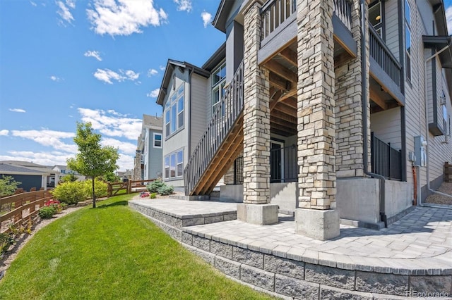 18926 W 94th Ave, Arvada, CO 80007 - view of property exterior with a patio and stairway