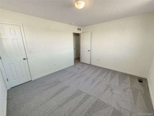 spare room with light colored carpet