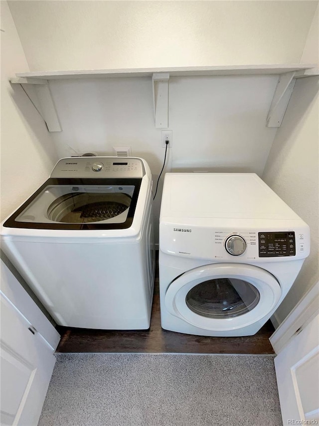 washroom featuring washing machine and dryer