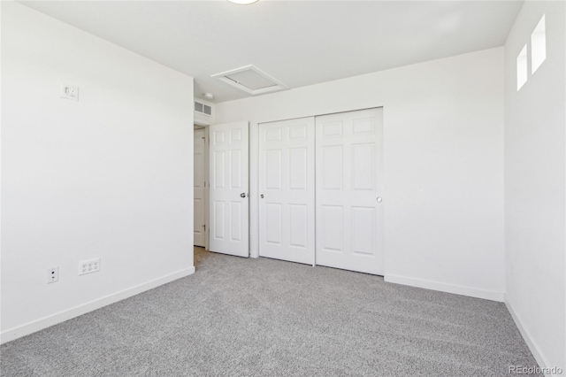 unfurnished bedroom with a closet and carpet