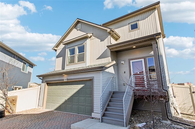 multi unit property featuring a garage