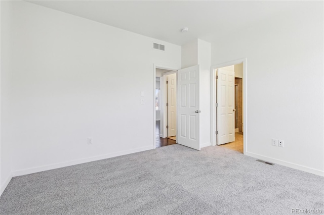 unfurnished bedroom with light carpet