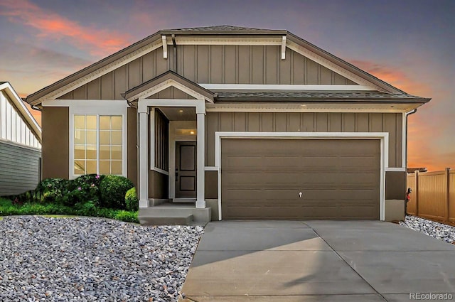 22384 E 49th Pl, Aurora, CO 80019 - view of front facade with concrete driveway, roof with shingles, and an attached garage
