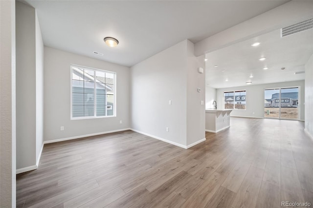 22384 E 49th Pl, Aurora, CO 80019 - unfurnished room featuring wood finished floors and recessed lighting